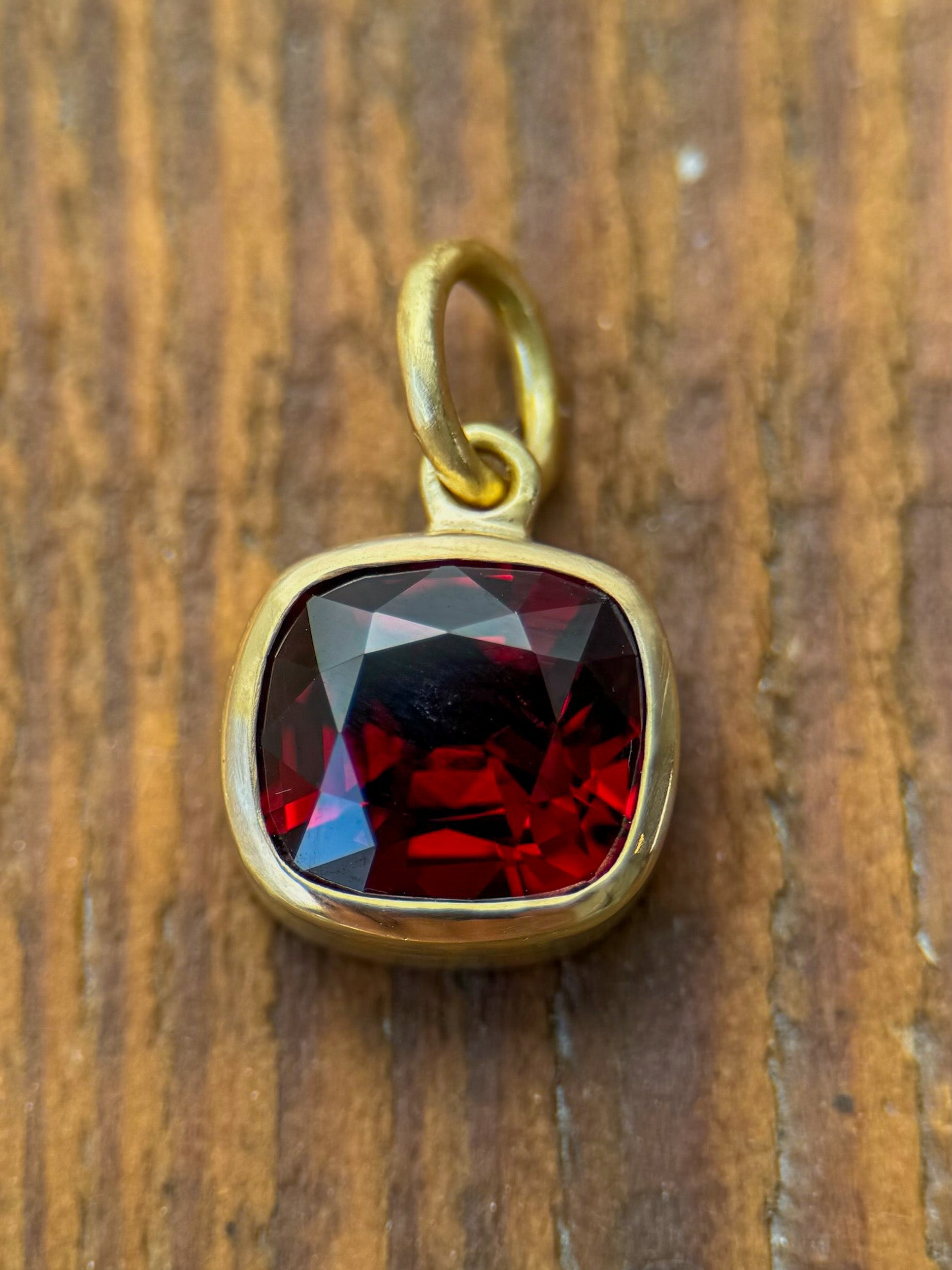 M & Co. Vivid Cushion Cut Red Garnet Pendant