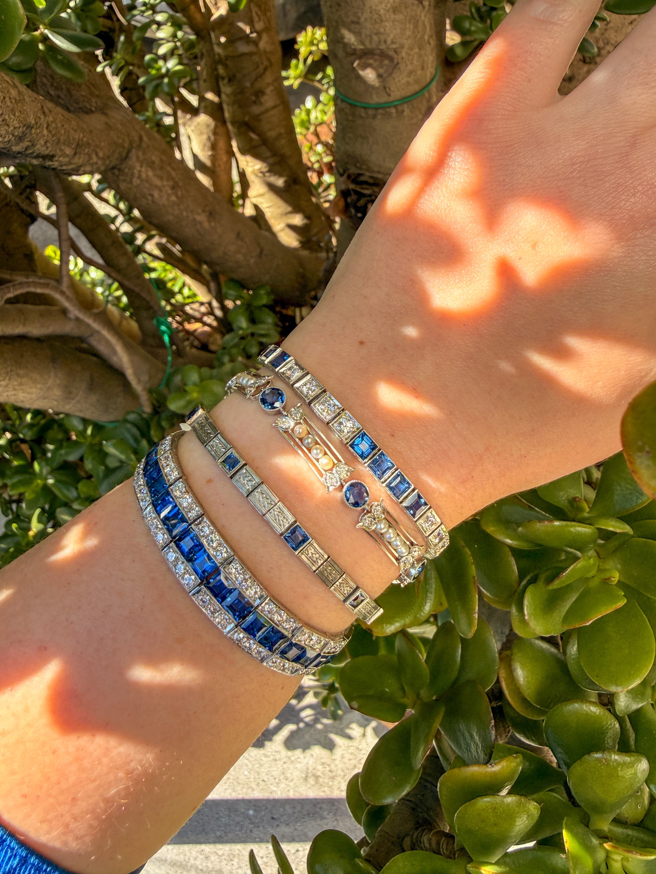 Platinum Art Deco Yogo Gulch Sapphire (22ct) & Diamond (9cttw) three row line bracelet AGL certified.