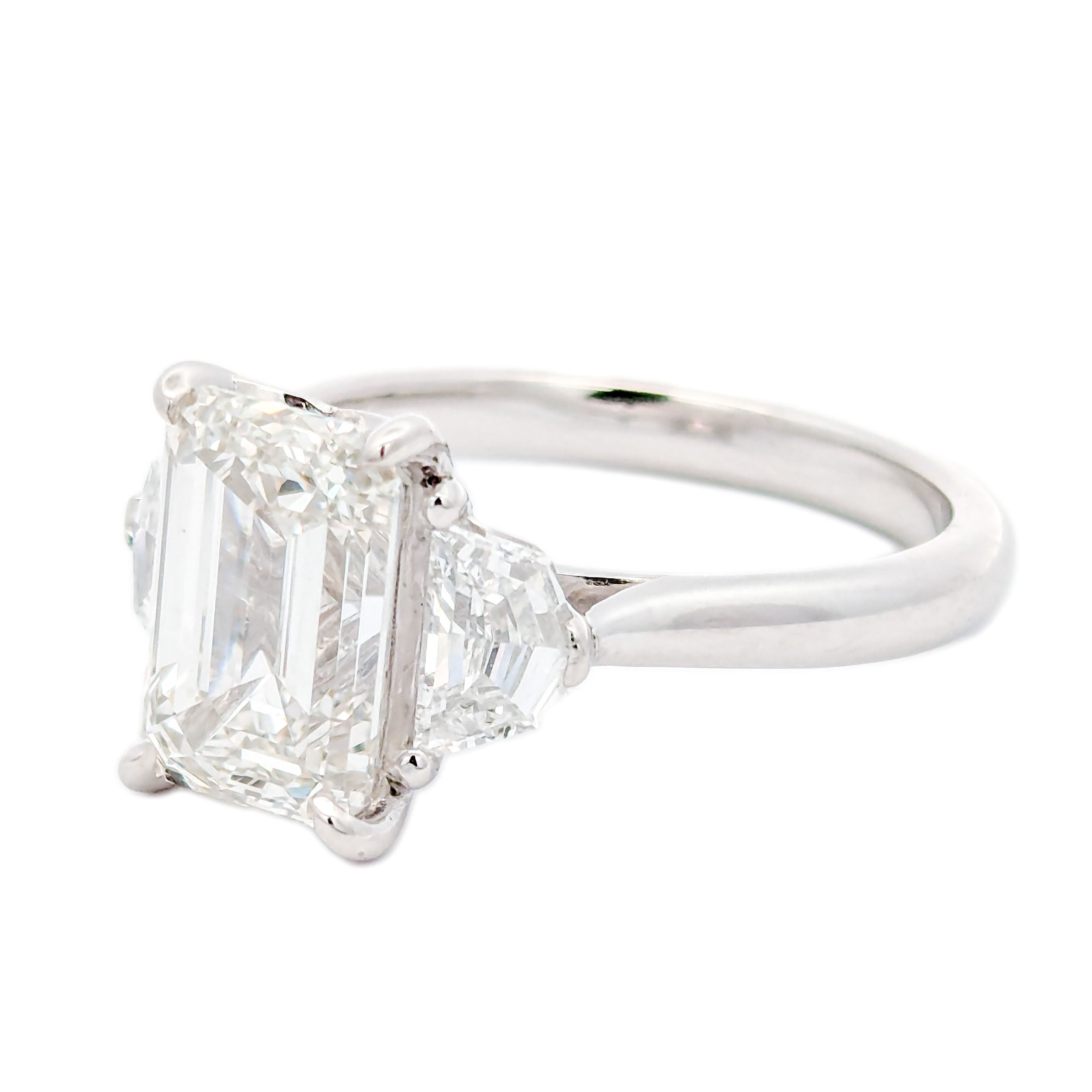M & Co. 3 CT Emerald Cut with Epaulette Accents Three Stone Ring