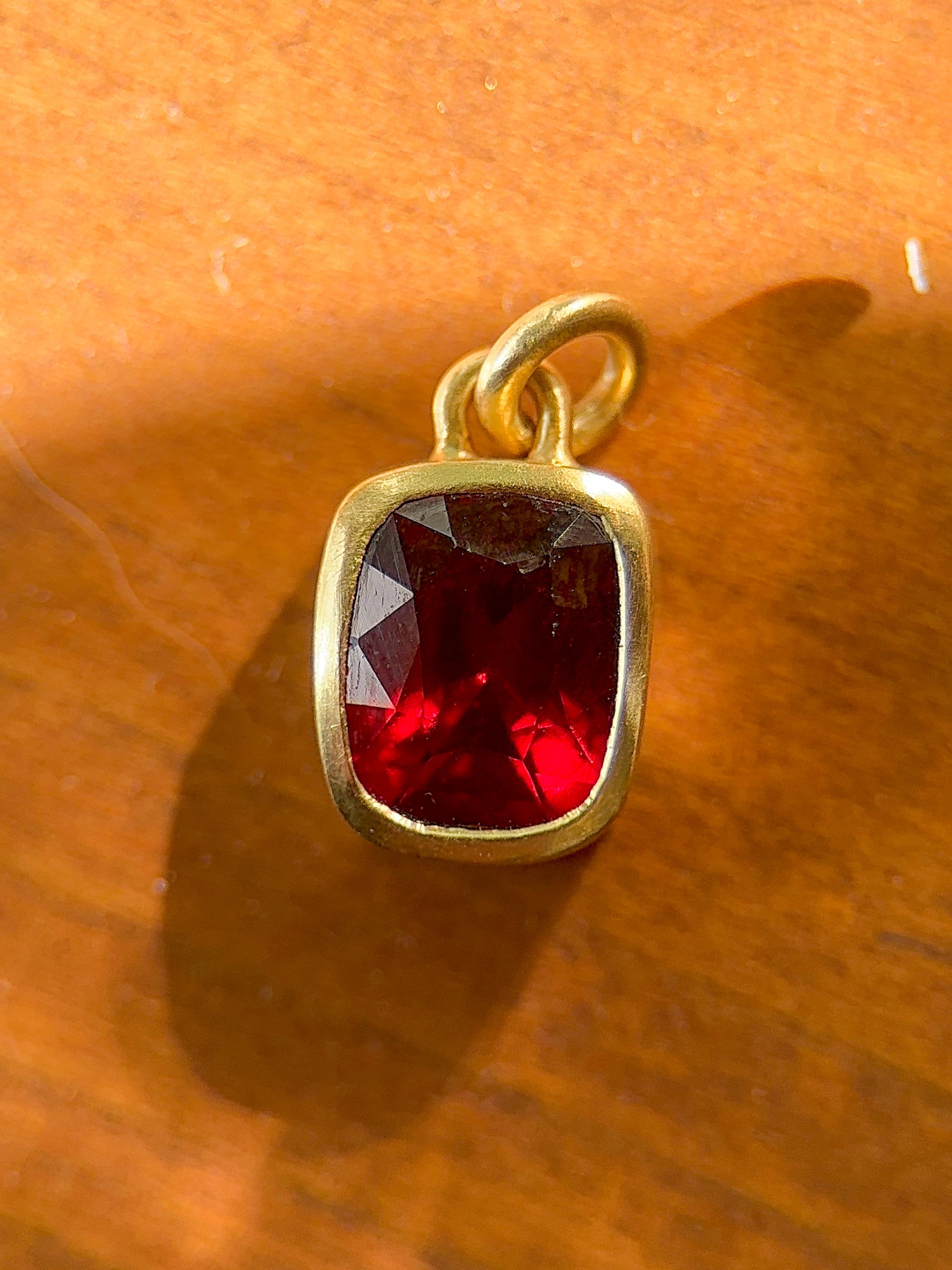 M & Co. Vivid Cushion Cut Red Garnet Pendant